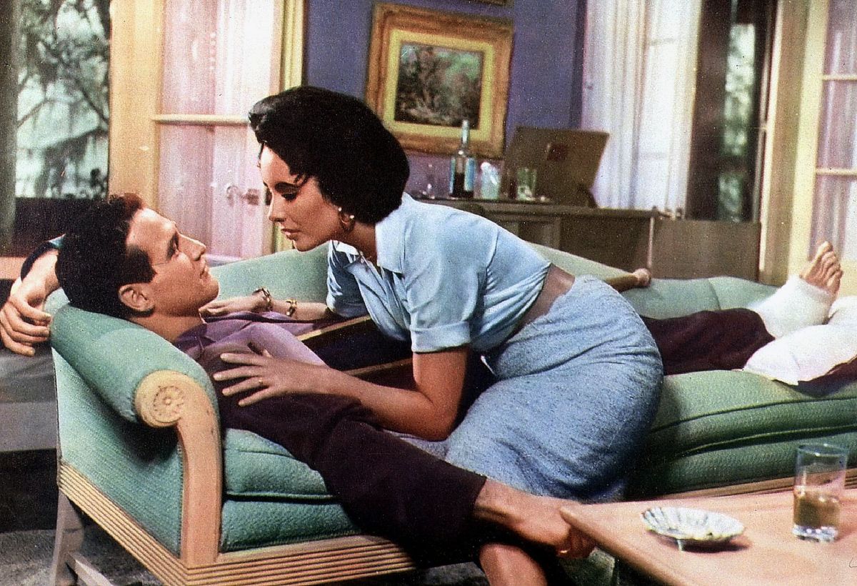 Элизабет Тейлор и Пол Ньюман в фильме «Кошка на раскалённой крыше», 1958 г. Элизабет Тейлор и Пол Ньюман в фильме «Кошка на раскалённой крыше»